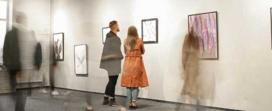 Exhibition in Modern Crowded Art Gallery